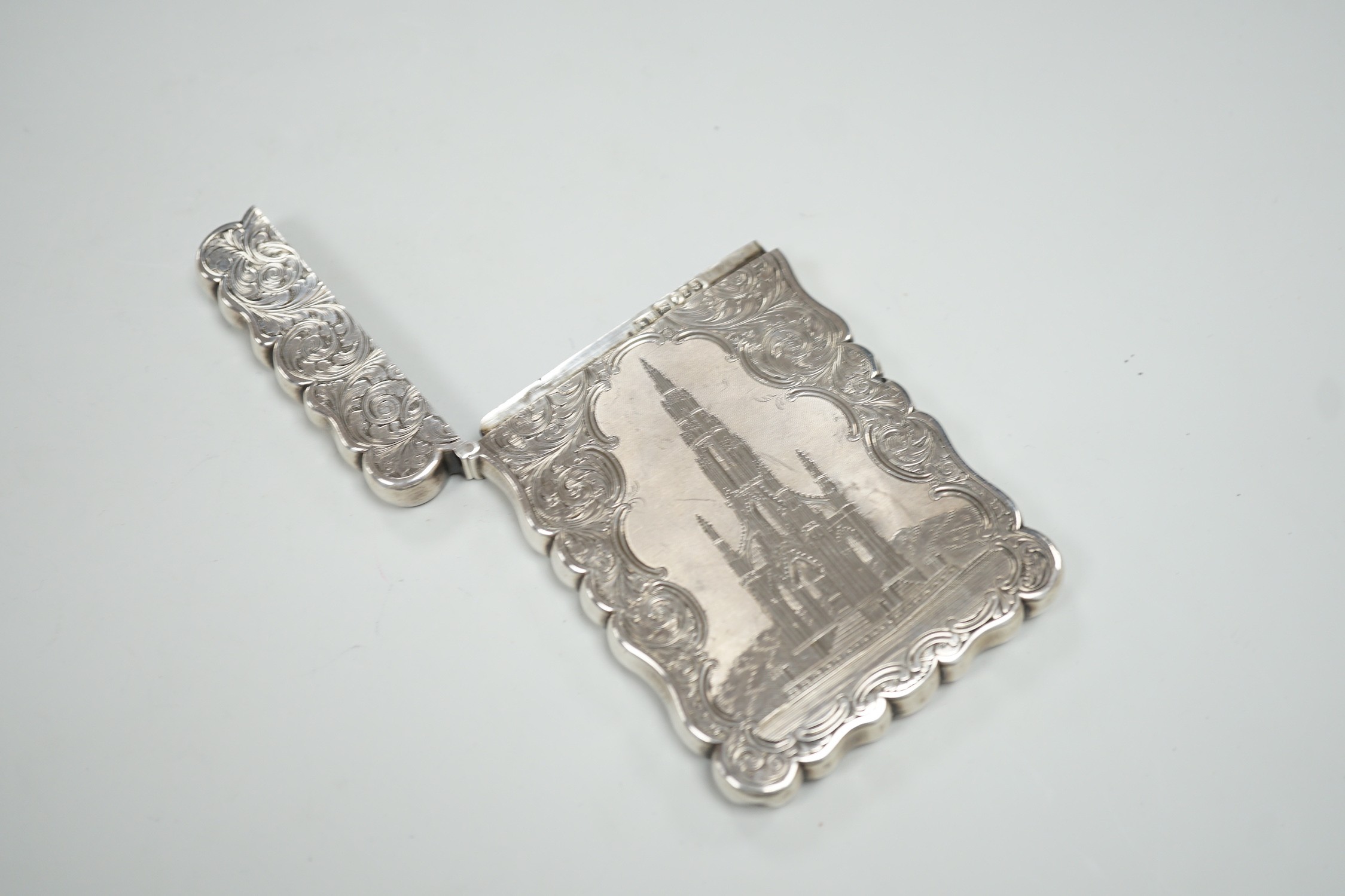 A Victorian silver card case by Nathaniel Mills, the front panel engraved with The Scott Memorial, Birmingham, 1848, 9.9cm.
